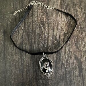 Black velvet choker with silver rose pendant